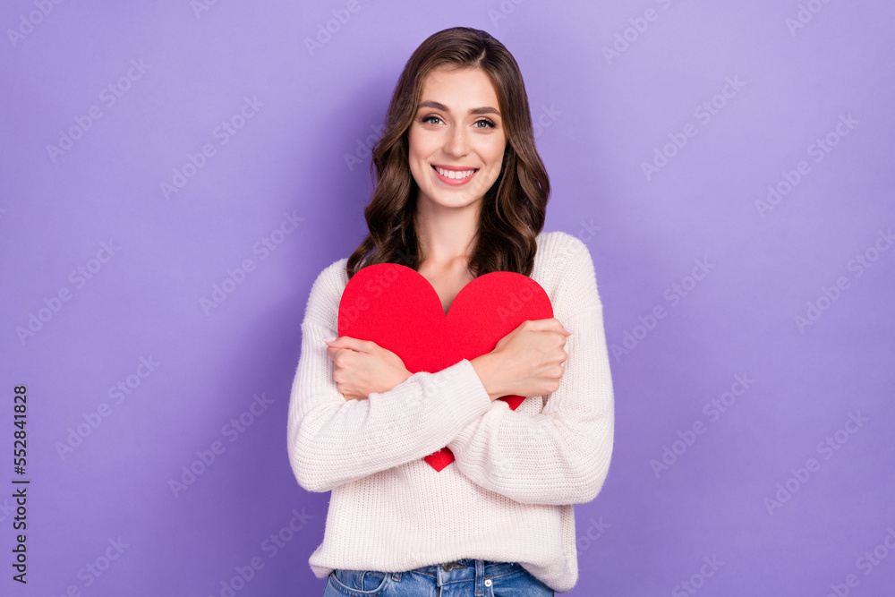 Photo of adorable pretty lady girlfriend hold red heart rejoice present romantic gift fell in love isolated on purple color background Photo of adorable pretty lady girlfriend hold red heart rejoice present romantic gift fell in love isolated on purple color background