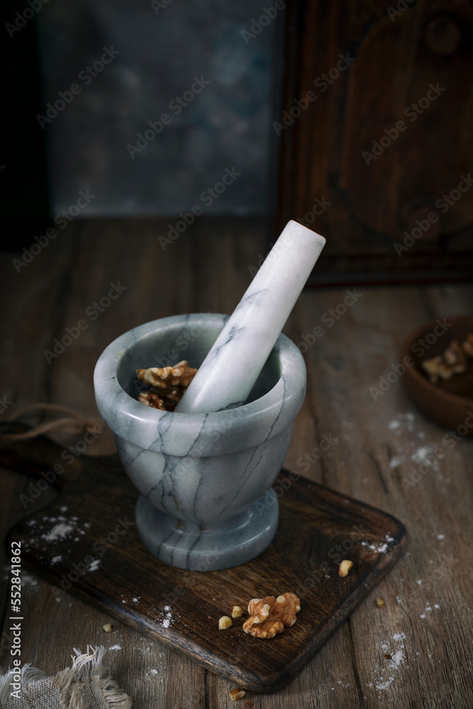 Gray stone mortar on a rustic table Gray stone mortar on a rustic table