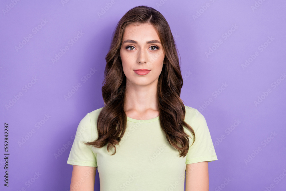 Photo of young adorable pretty cute lady wear white t-shirt curly long hair look concentrated you use best lotion isolated on violet color background Photo of young adorable pretty cute lady wear white t-shirt curly long hair look concentrated you use best lotion isolated on violet color background