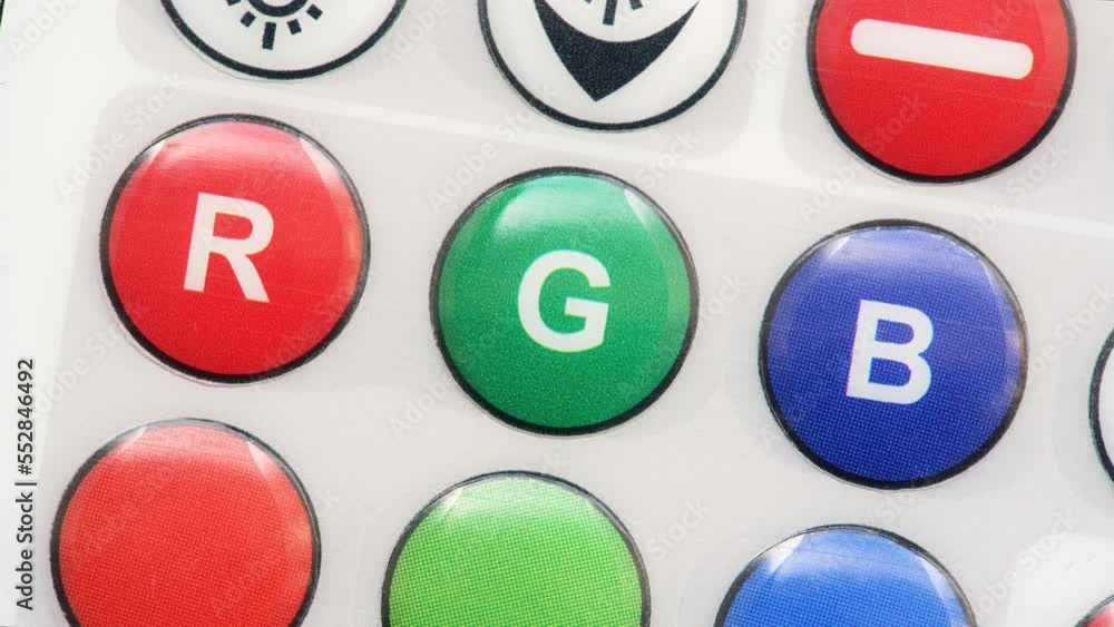 Red green blue RGB color lights remote control, buttons, primary colors lighting controls abstract concept, smart home lighting technology. Object detail, macro, extreme closeup, three basic colors Red green blue RGB color lights remote control, buttons, primary colors lighting controls abstract concept, smart home lighting technology. Object detail, macro, extreme closeup, three basic colors