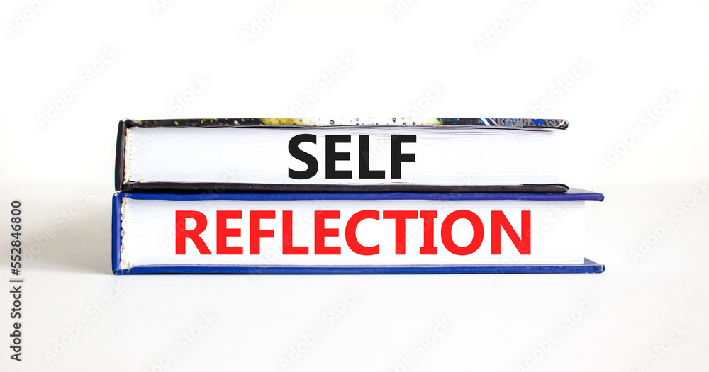 Self reflection symbol. Concept word Self reflection typed on books. Beautiful white table white background. Business psychological and self reflection concept. Copy space.