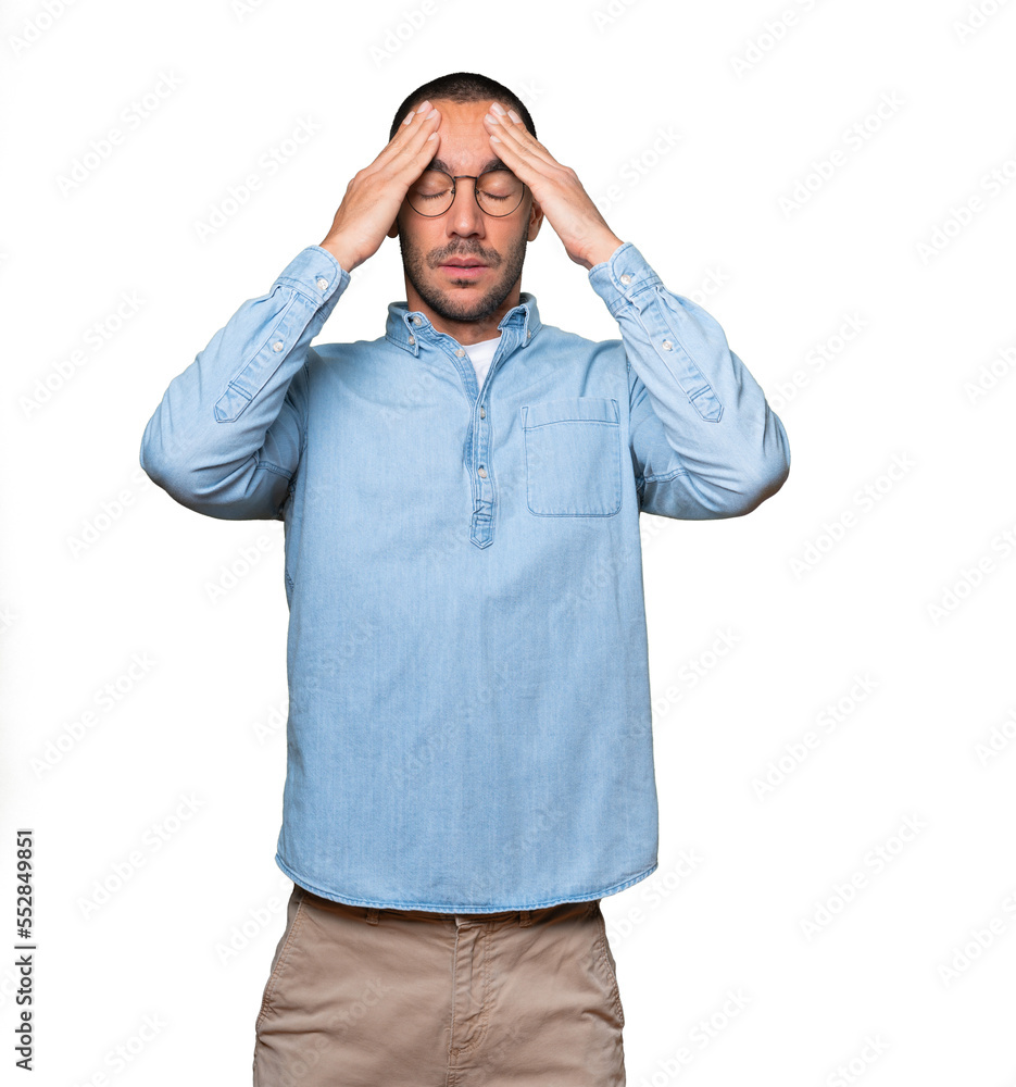 Naklejka premium Concerned young man with a stress gesture