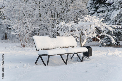 Wallpaper Mural A bench in the snow stands in the park Torontodigital.ca