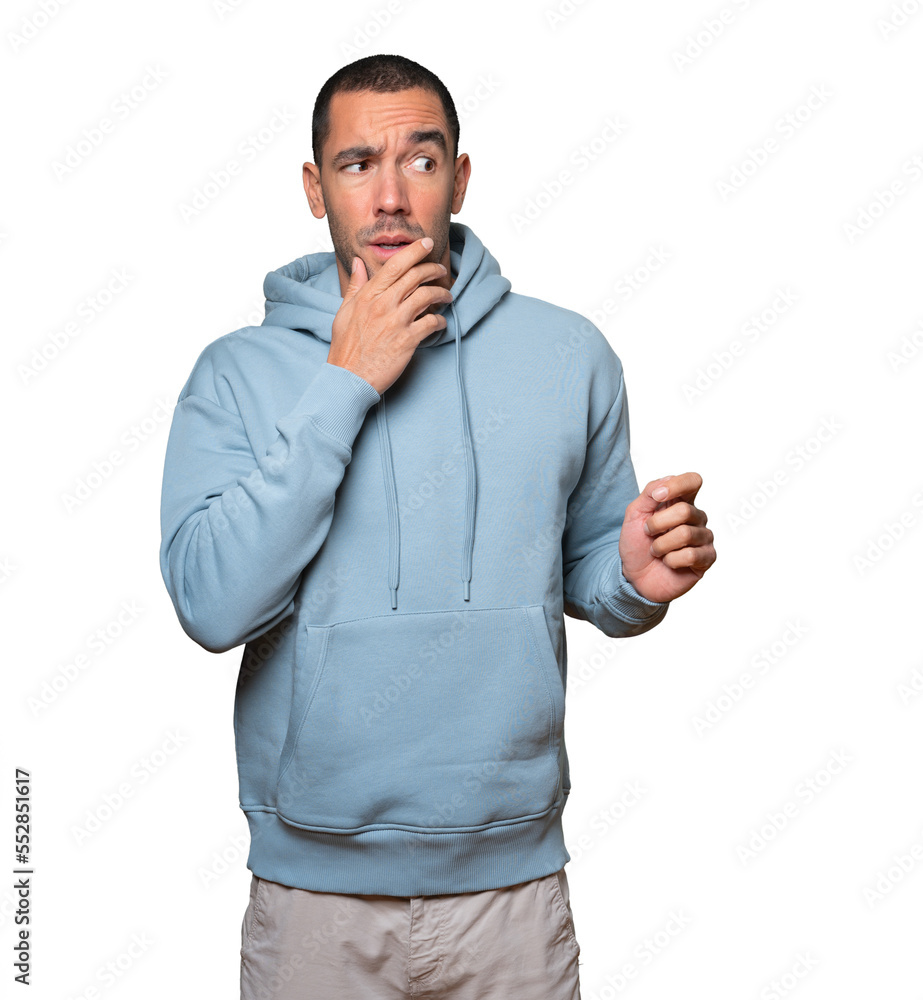 Astonished young man with a gesture of shock Astonished young man with a gesture of shock