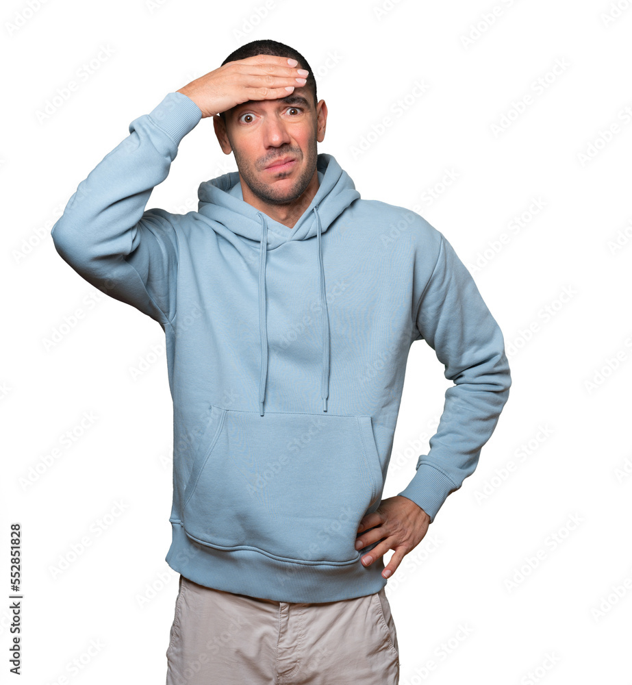 Depressed young man posing against background Depressed young man posing against background