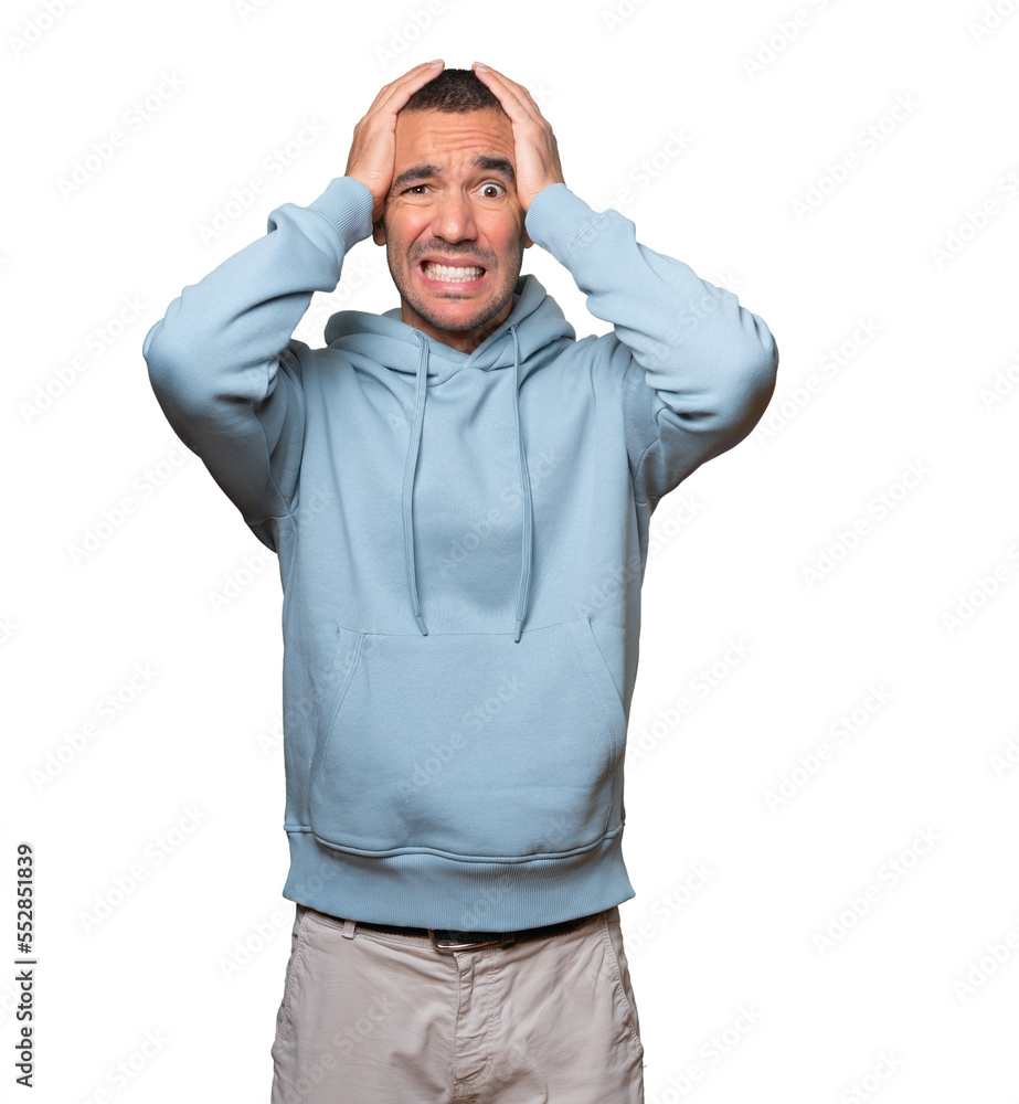 Crazy young man making a gesture of despair Crazy young man making a gesture of despair