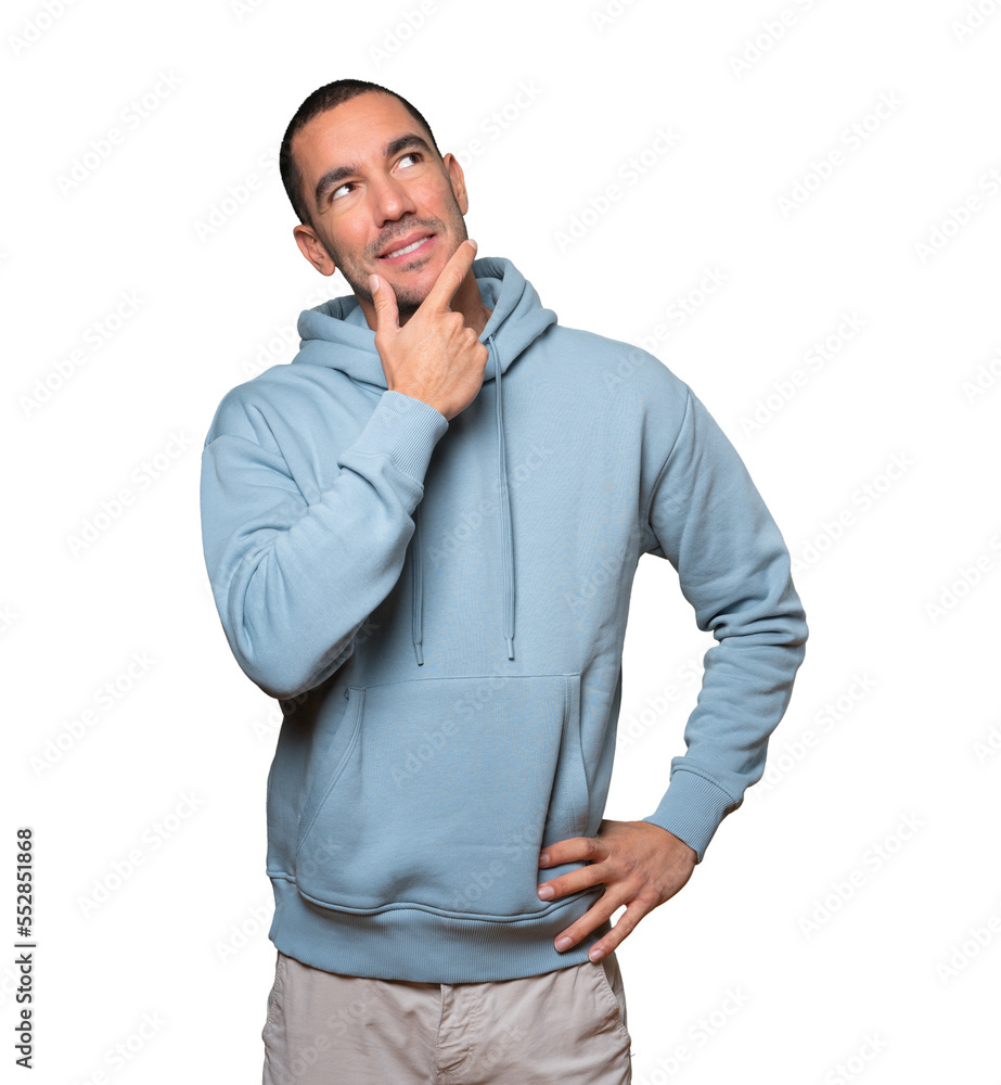 Happy young man making a gesture of doubt Happy young man making a gesture of doubt