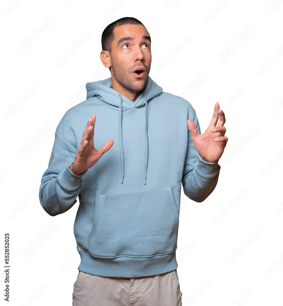 Fototapeta premium Happy young man looking up gesture