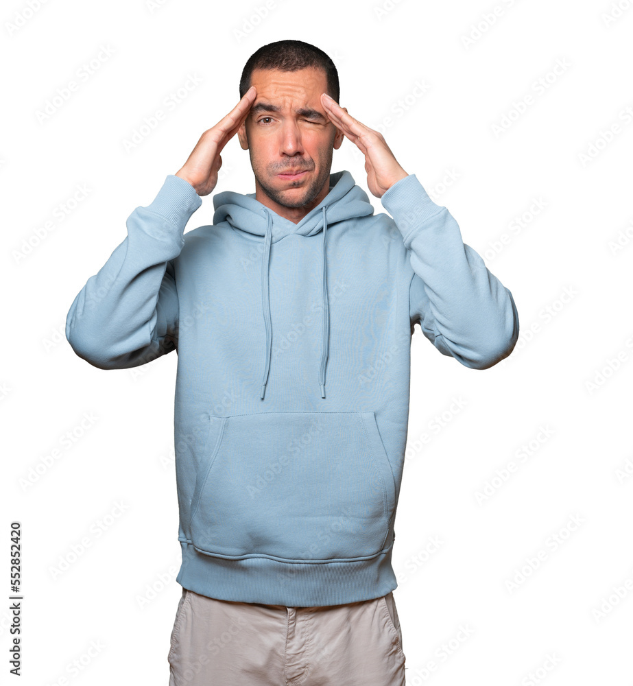 Concerned young man with a stress gesture