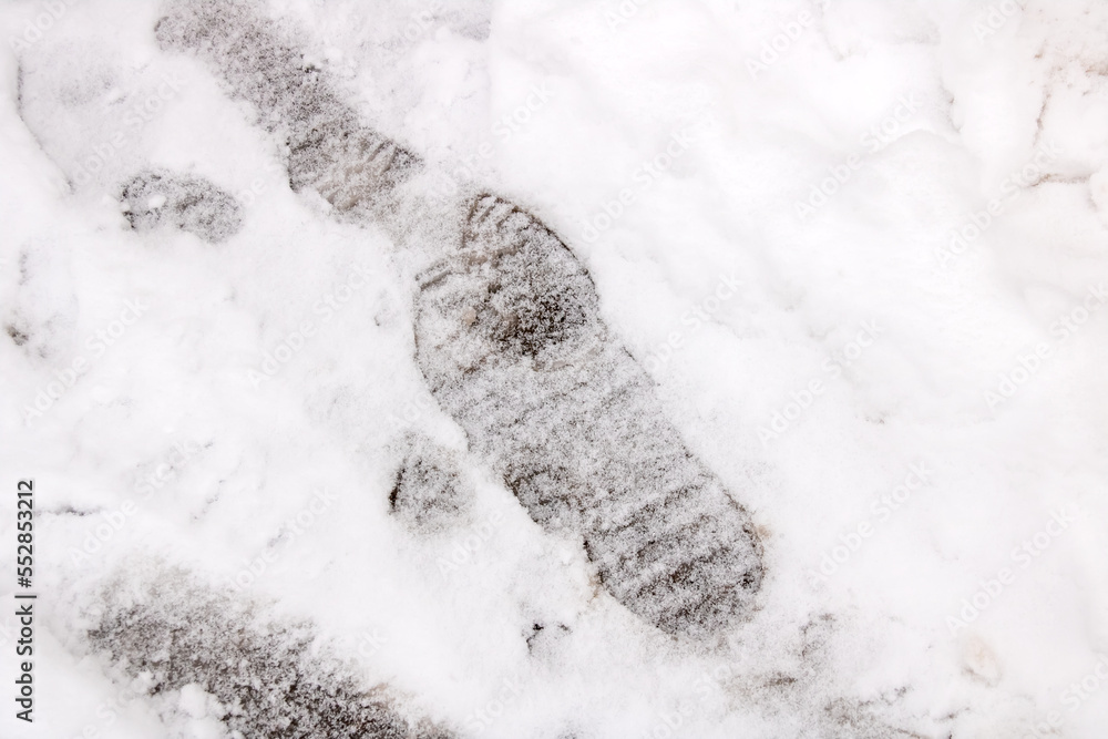 Shoe tracks on white snow close up Shoe tracks on white snow close up