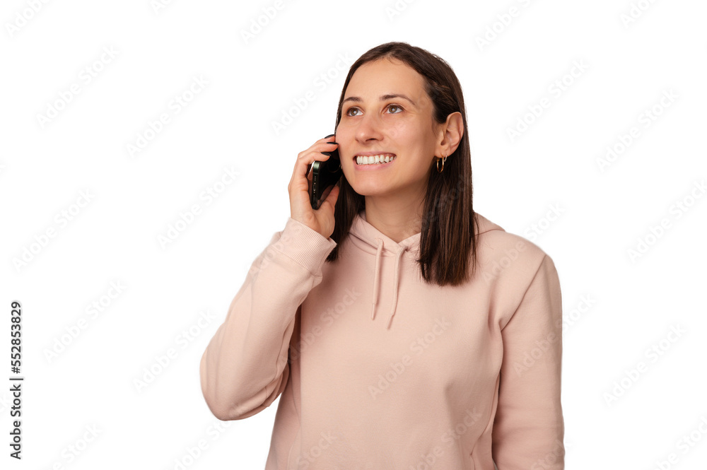 Brunette smiling woman has a nice conversation over phone with someone dear over white background. Brunette smiling woman has a nice conversation over phone with someone dear over white background.
