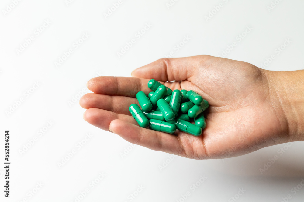 Rhodiola rosea capsules on a female hand. Rhodiola rosea capsules on a female hand.