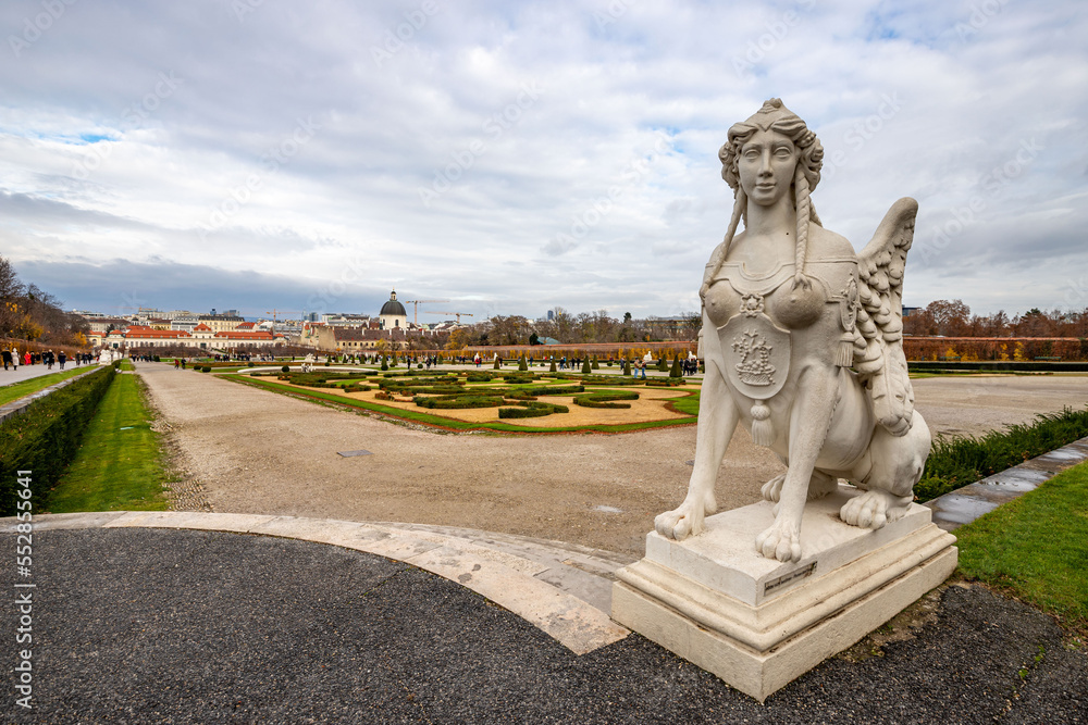Fototapeta premium Cityscape with the garden of Schloss Belvedere in Vienna and its statue. Belvedere Castle during the Christmas holidays.
