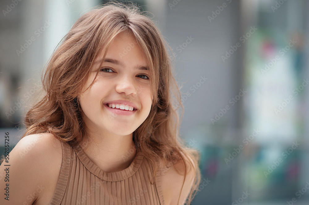 Portrait of beautiful teenage girl in shopping mall. Space for text Portrait of beautiful teenage girl in shopping mall. Space for text