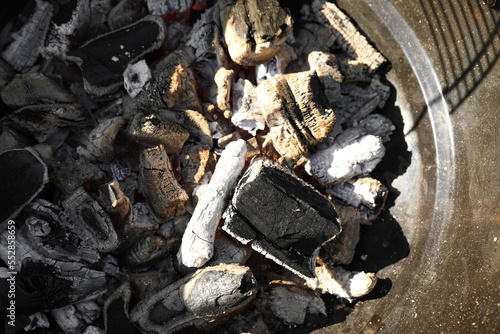 Barbecue grill with coals outdoors, top view