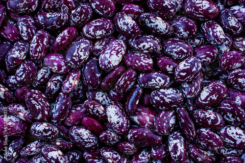grains of red dry beans, background with legumes, healthy vegetarian food