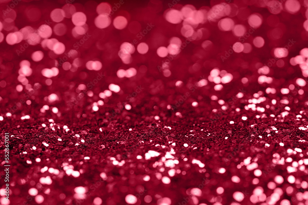 Beautiful Christmas viva magenta light background. Abstract glitter bokeh and scattered sparkles