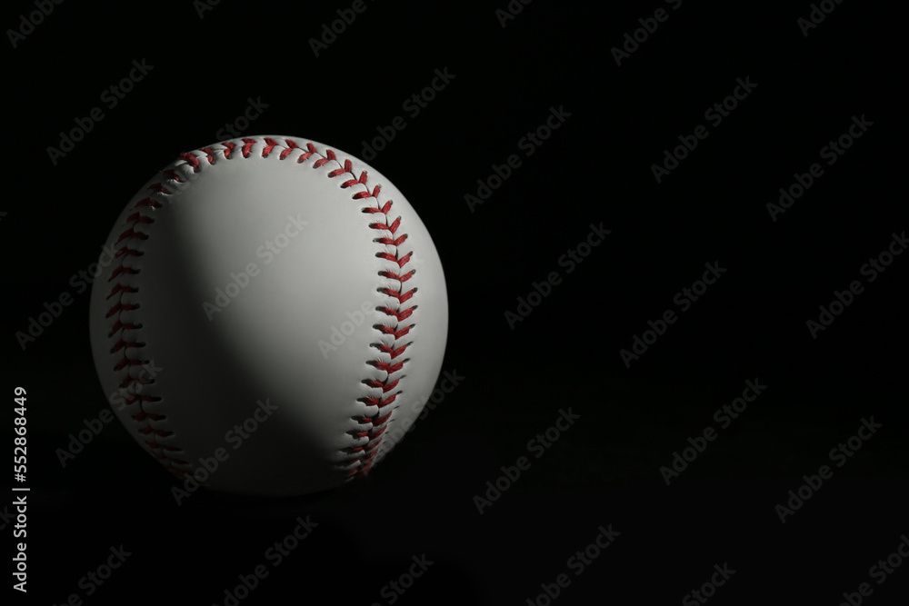 Baseball ball on black background, space for text. Sports game Baseball ball on black background, space for text. Sports game