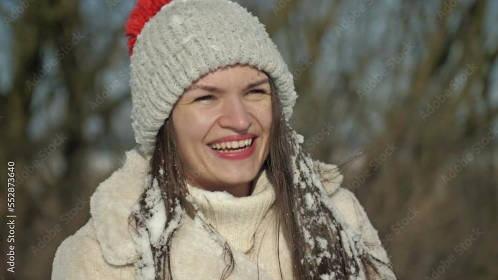 Beautiful young woman enjoys a sunny winter day and the snow. Beautiful young woman enjoys a sunny winter day and the snow.