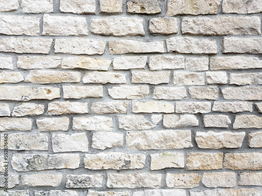Old bright white pattern stone wall texture. Old bright white pattern stone wall texture.