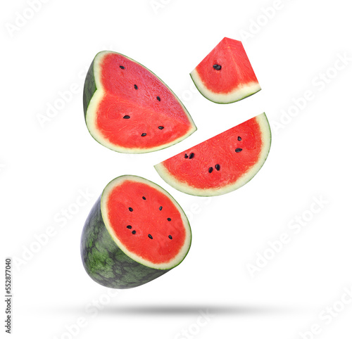 Slices of watermelon falling in the air isolated on white background.