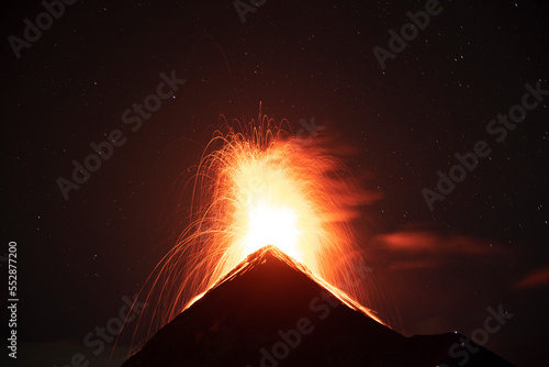 Night eruption of the Fuego volcano photo