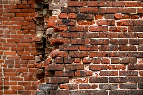 Vászonkép falling apart brick wall with bricks missing