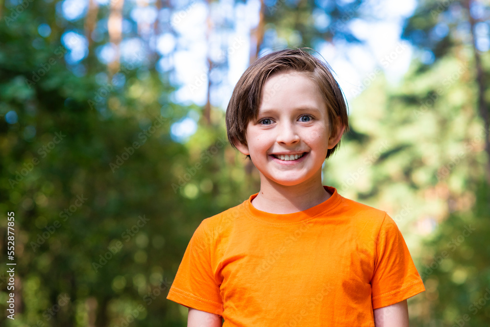 portrait of a happy boy in the forest on a sunny day in summer portrait of a happy boy in the forest on a sunny day in summer
