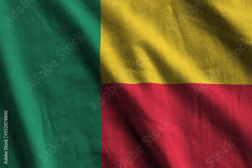 Benin flag with big folds waving close up under the studio light indoors. The official symbols and colors in fabric banner photo