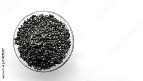 Obraz na plátně Black moong, mung or whole black urad beans in a glass bowl isolated on white background