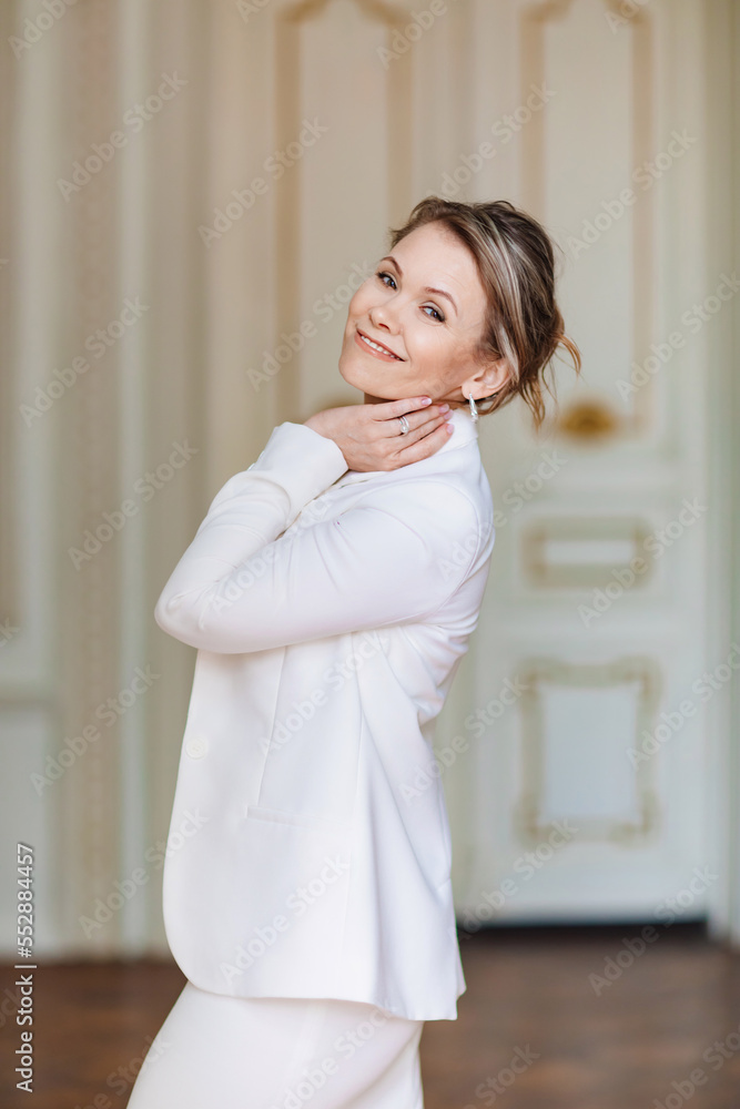 a beautiful and confident woman wearing a white dress and jacket a beautiful and confident woman wearing a white dress and jacket