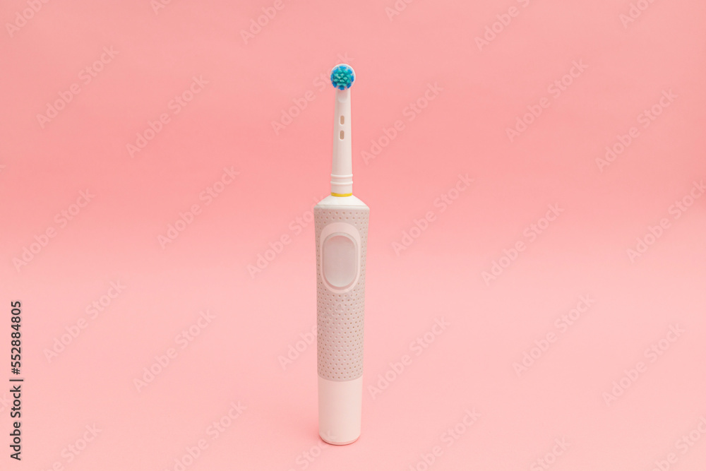 Electric tooth counter with nozzle on a pink background Electric tooth counter with nozzle on a pink background