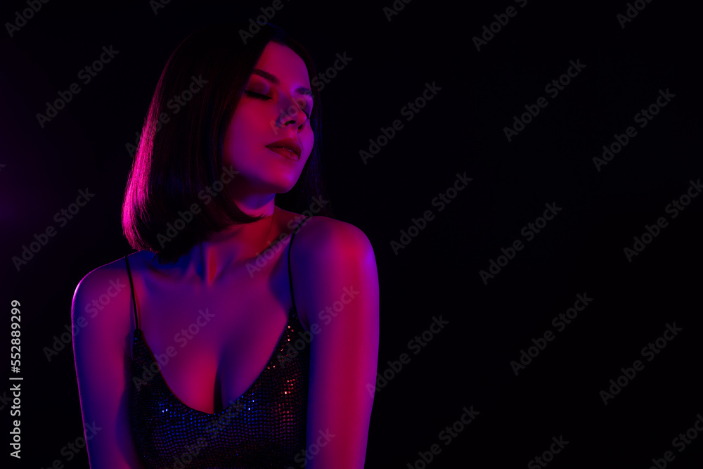 Fototapeta premium Full of tenderness stunning woman close her eyes enjoy music rhythms nigh club stylish lights colorful background
