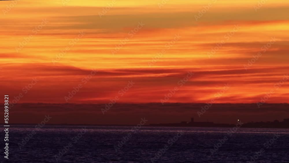 Landscape of a bright red sunset over a blue river Landscape of a bright red sunset over a blue river