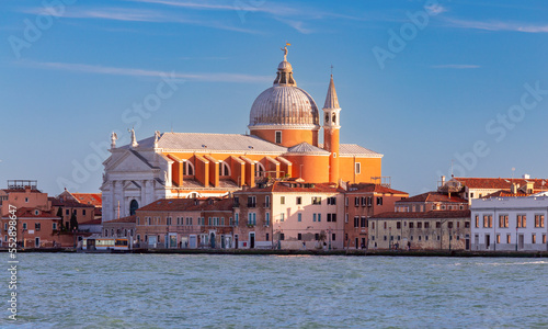 View of the city waterfront church and the Grand Canal at sunset.