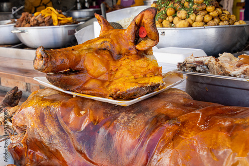 Whole roasted pig (chancho, hornado) in traditional cuisine restaurant. Ecuador. Cuenca photo