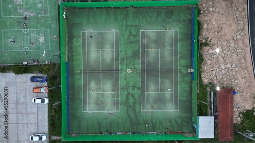aerial view of two green  tennis courts