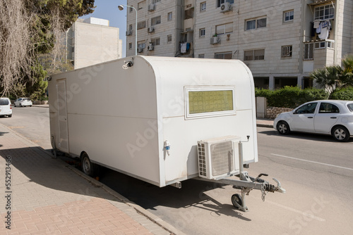 Old home on wheels trailer as tiny house on street in israel photo