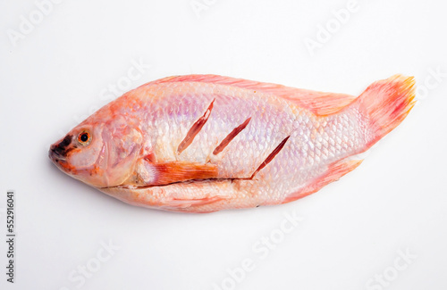 fresh red pomegranate fish on a white background