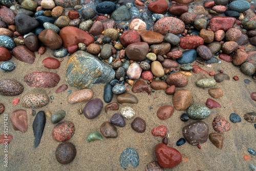 Background of multicolored sea pebbles on the shore of the Baltic Sea, Svetlogorsk, Kaliningrad region, Russia photo