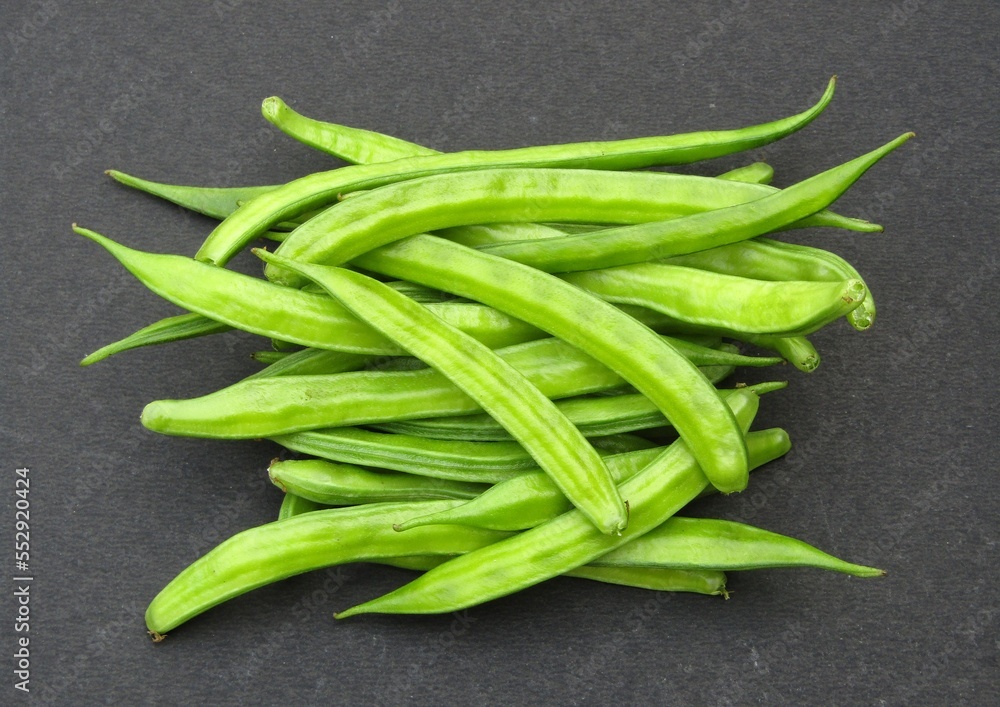 Fresh guar or cluster bean on black background Fresh guar or cluster bean on black background