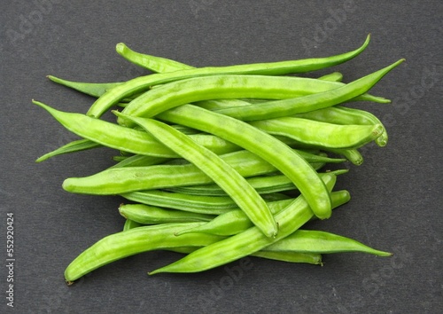 Fresh guar or cluster bean on black background 