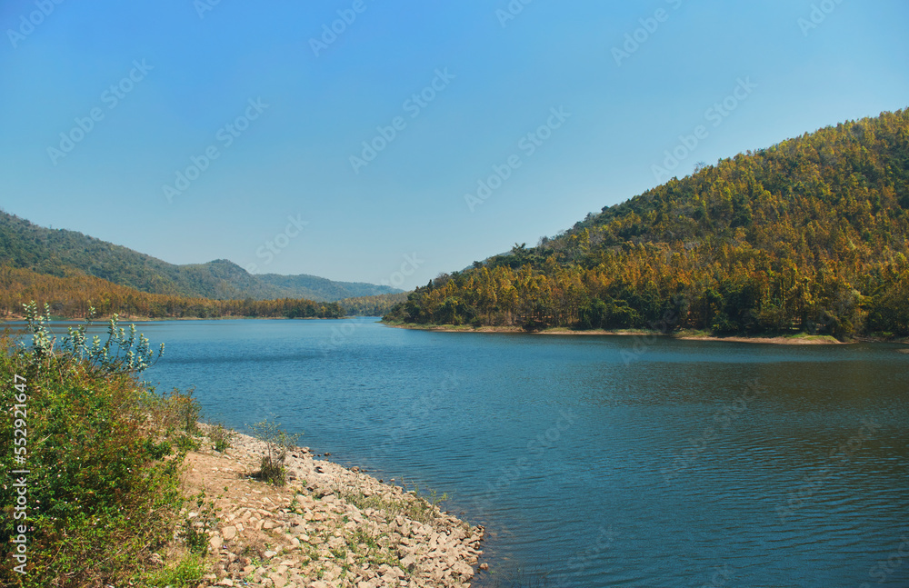 scenic view of Khairabera Dam lake (water reservoir) and the heavily forested majestic Ajodhya Hills surrounding the area of khairaberia irrigation project, in Purulia district of West Bengal.