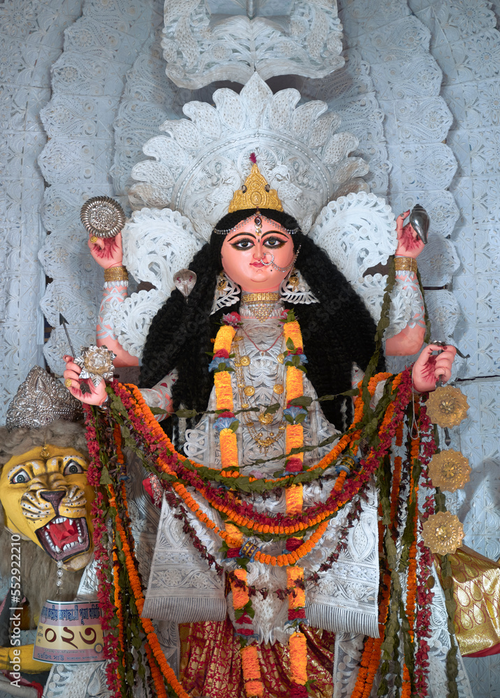 Fototapeta premium A gorgeous looking divine idol of Hindu Goddess Jagatdhatri / Jagaddhatri inside puja pandal. Shot at Chandannagar, West Bengal where it is a major religious festival.