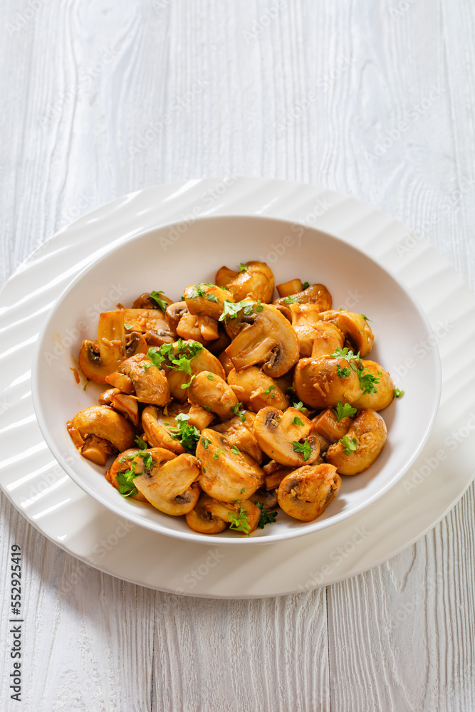 Spanish Garlic Mushrooms in bowl, top view Spanish Garlic Mushrooms in bowl, top view