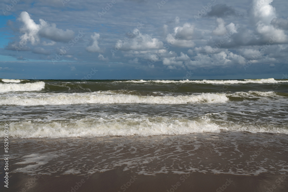 View of the incoming wave on the Baltic Sea on the shore of the Curonian Spit on a summer day, Kaliningrad region, Russia