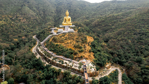 Giant Buddha Statue Khao Wongphrachan, Wat Khao Wong Phra Chan temple at top of mountain photo