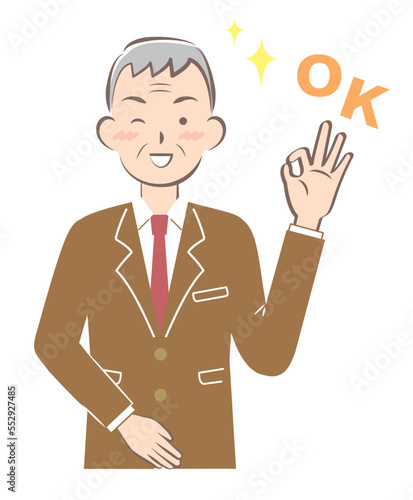 OKサインを出すスーツ姿のシニア男性