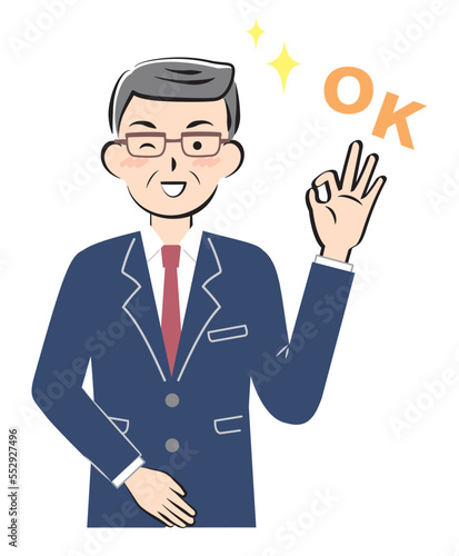 OKサインを出すスーツ姿のシニア男性