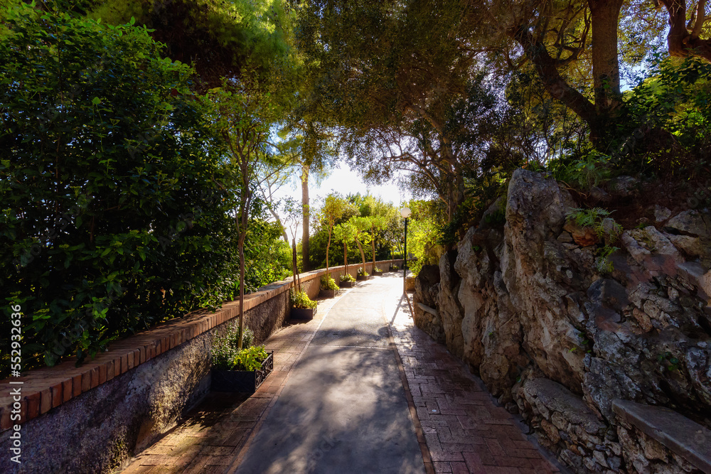 Path in a Garden with trees and flowers. Touristic Town on Capri Island in Bay of Naples, Italy. Path in a Garden with trees and flowers. Touristic Town on Capri Island in Bay of Naples, Italy.